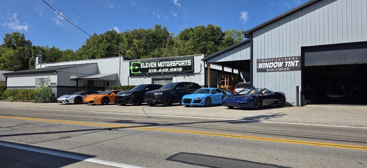Eleven Motorsports storefront with exotic cars